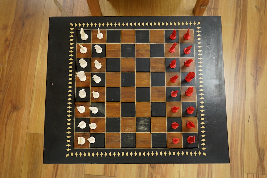 A Sri Lankan chess table and a boxed bone chess set, table measures 62cm high. Condition - good